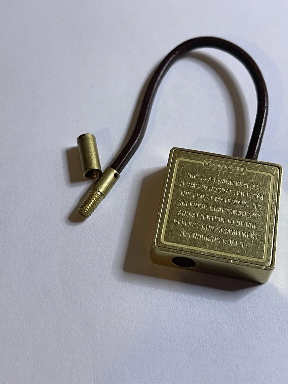 Coach Gold-Tone Brass Key Fob with Brown Leather Loop and Coach Pen